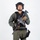 MCAS Marines pose for content 2026 A male individual in full tactical gear is posed against a plain white background in what appears to be a professional studio photograph. He is equipped with military/law enforcement-style equipment including body armor, helmet, and weapons. The image appears to be a reference or documentation photograph.