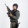 MCAS Marines pose for content 2026 A male individual in full tactical law enforcement or military-style gear is posed against a plain white studio background. He is holding an assault-style rifle in a ready position and is equipped with extensive tactical equipment. The image appears to be a professional studio photograph, likely for promotional or documentation purposes.