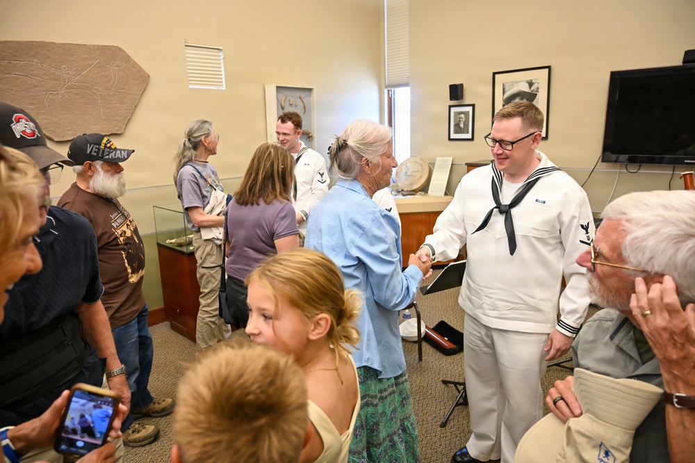 Musician 3rd Class Erik Malmer Greets Audience at Pictograph Cave State Park
