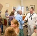 Musician 3rd Class Erik Malmer Greets Audience at Pictograph Cave State Park
