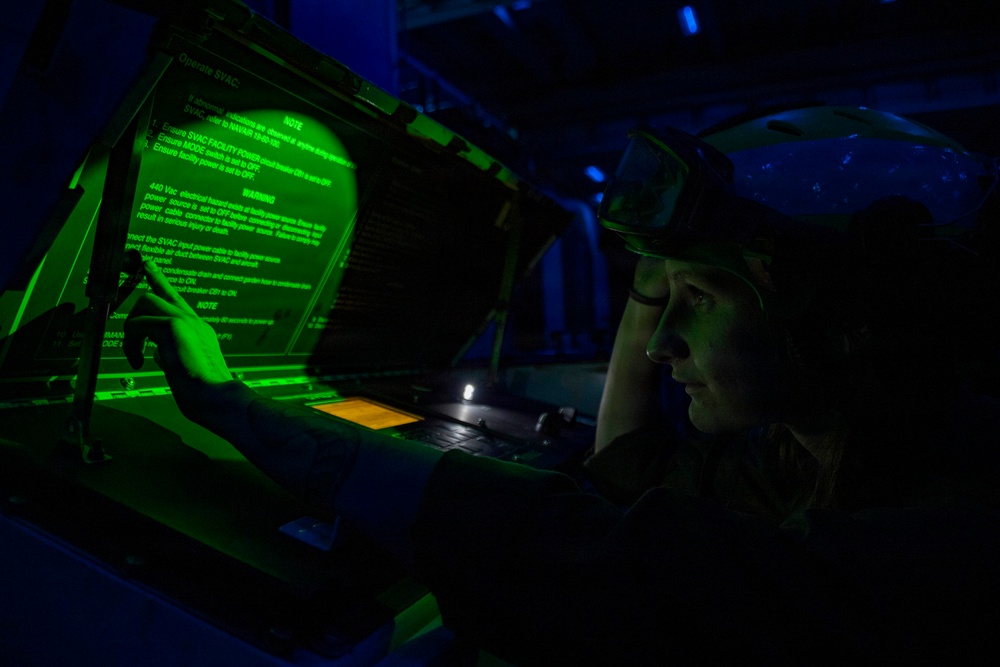U.S. Marine Airframe Mechanic Performs Aircraft Maintenance