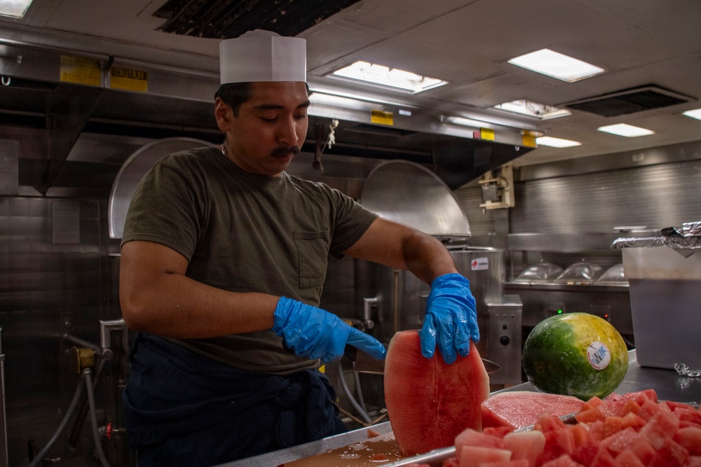 Food Service Specialist Prepares Fruit for the Galley