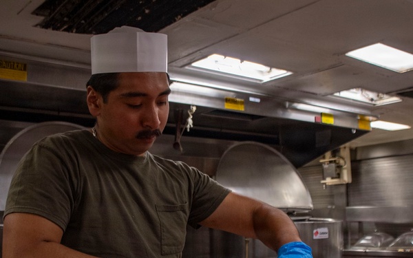 Food Service Specialist Prepares Fruit for the Galley
