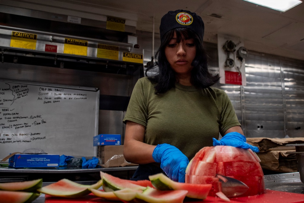 Food Service Specialist Prepares Fruit for the Galley