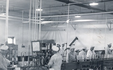 Historical McAlester Army Ammunition Plant photo - circa 1940's- people working on bomb lin