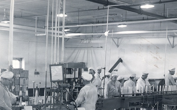 Historical McAlester Army Ammunition Plant photo - circa 1940's- people working on bomb lin