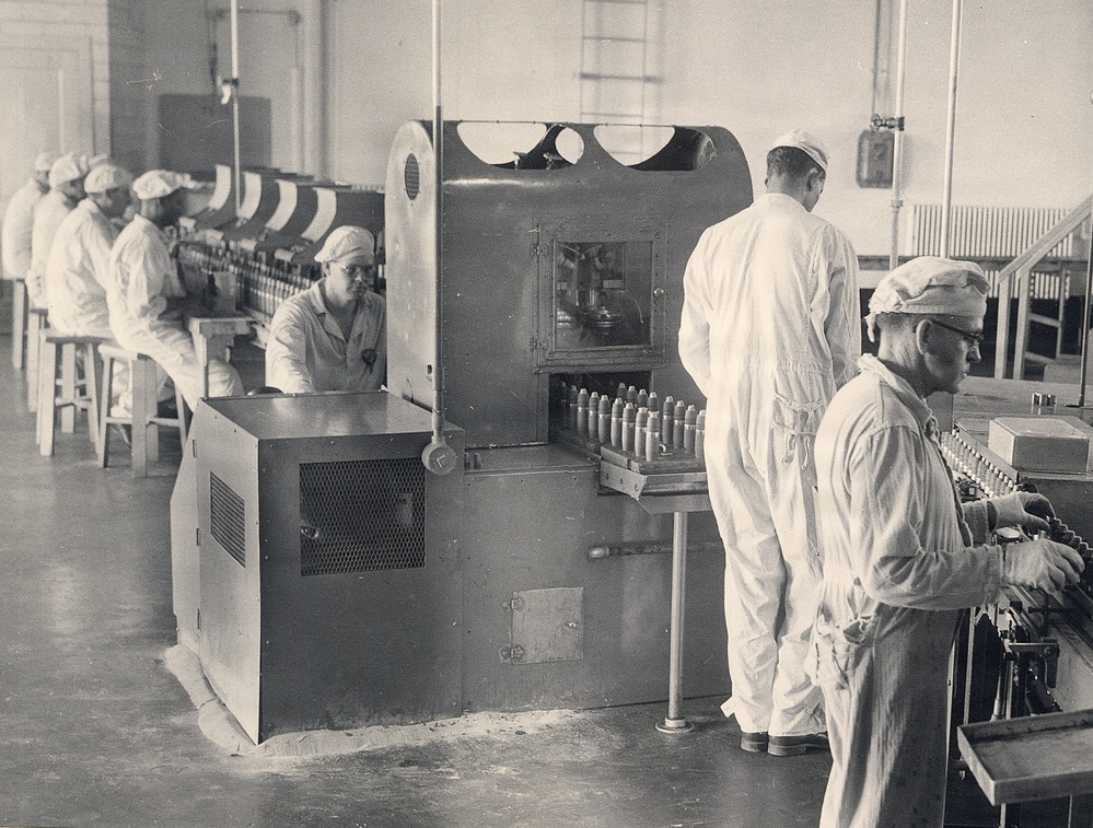 Historical McAlester Army Ammunition Plant photo - circa 1940's- people working on bomb line.