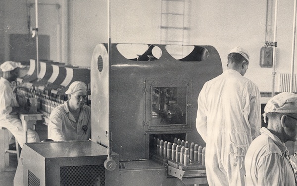 Historical McAlester Army Ammunition Plant photo - circa 1940's- people working on bomb line.