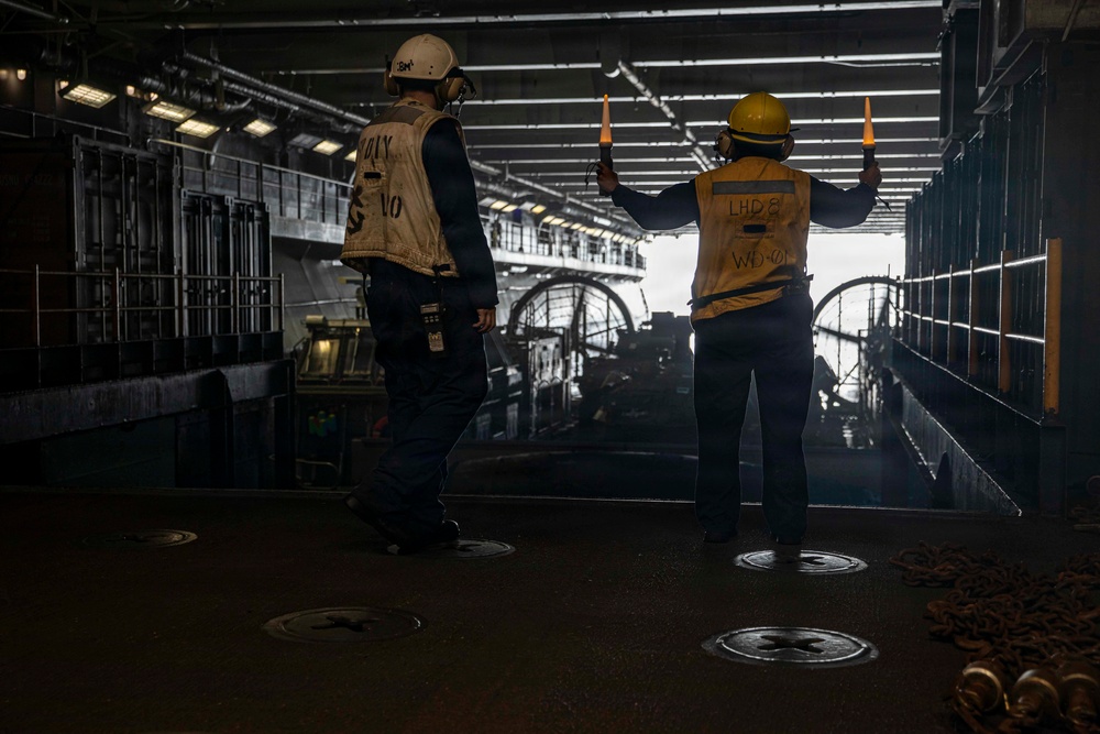 U.S. Navy Boatswain's Mate Signals Landing Craft, Air Cushion 64