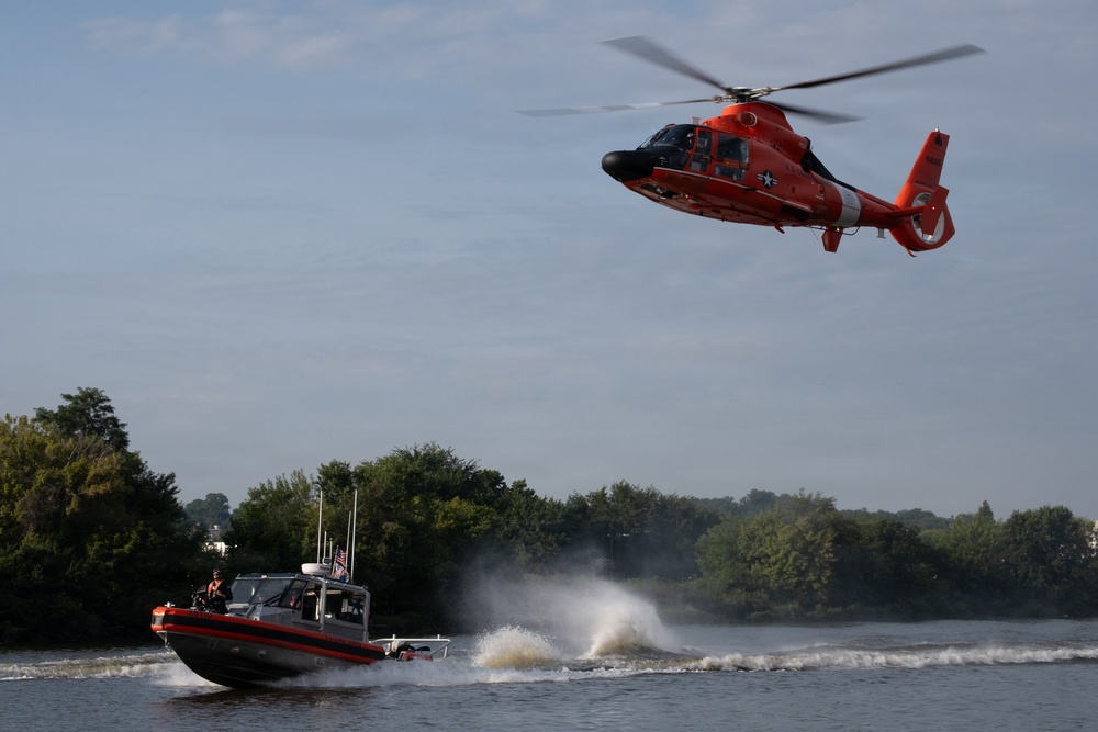 U.S. Coast Guard HH-65 Dolphin helicopter and response boat conduct joint patrol exercise on the Potomac