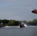 U.S. Coast Guard MH-65 Dolphin helicopter and response boats conduct joint patrol operations on inland waterway