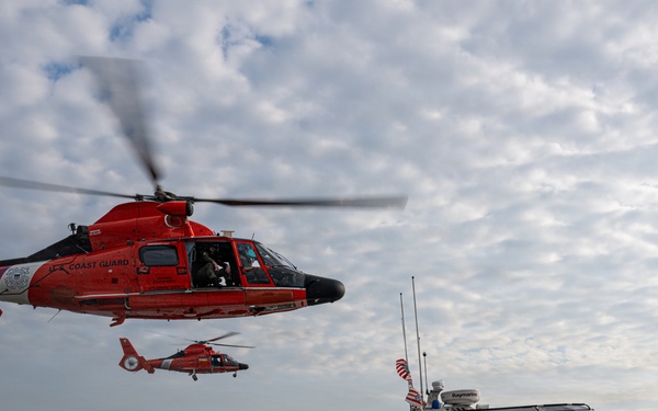 U.S. Coast Guard helicopters and patrol boat conduct joint operations on the Potomac River