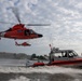 U.S. Coast Guard helicopters and patrol boat conduct joint operations on the Potomac River