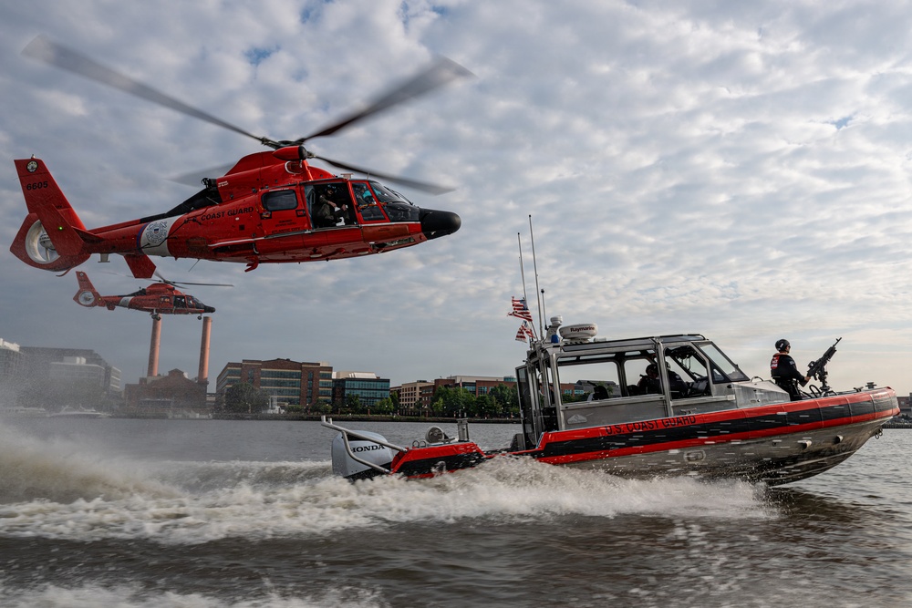 U.S. Coast Guard helicopters and armed patrol boat conduct joint operations on the Potomac River near Washington, D.C.