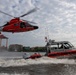 U.S. Coast Guard helicopters and armed patrol boat conduct joint operations on the Potomac River near Washington, D.C.