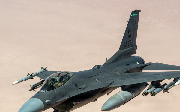 KC-135 refuels F16s for theater stability