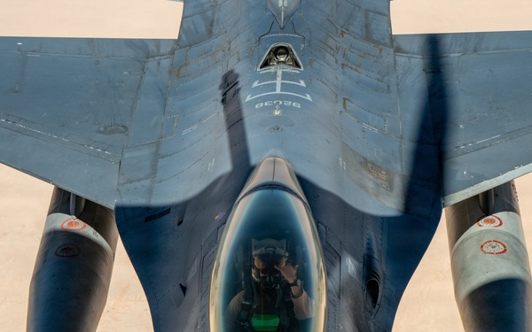 KC-135 refuels F16s for theater stability