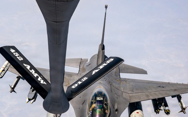 KC-135 refuels F16s for theater stability
