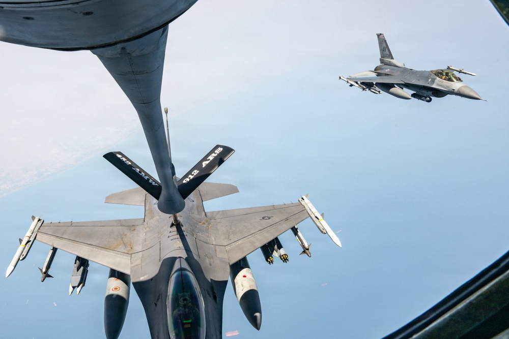 KC-135 refuels F16s for theater stability