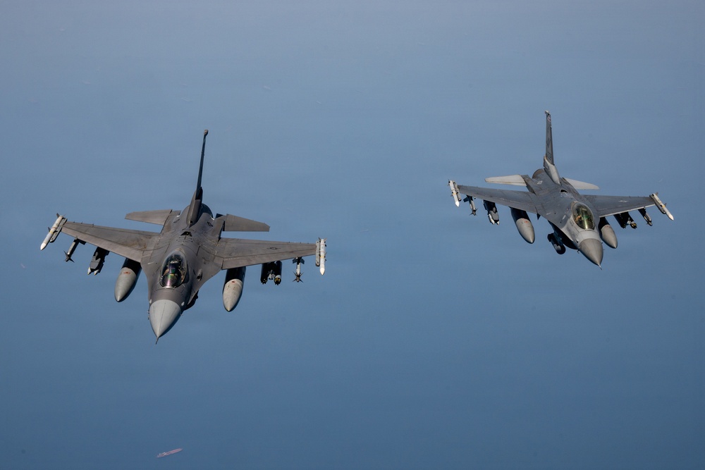 KC-135 refuels F16s for theater stability