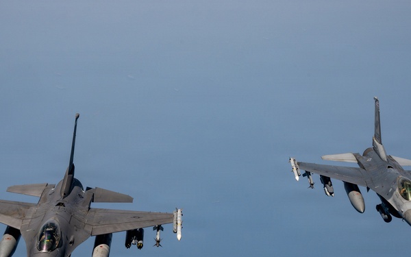 KC-135 refuels F16s for theater stability