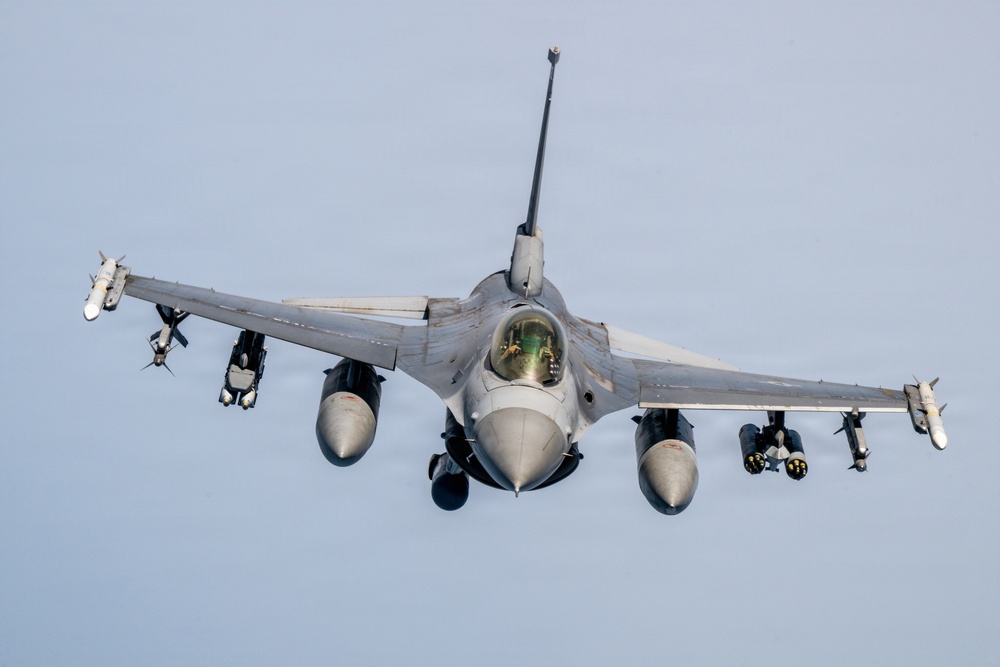 KC-135 refuels F16s for theater stability