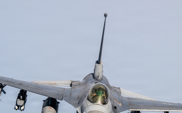 KC-135 refuels F16s for theater stability