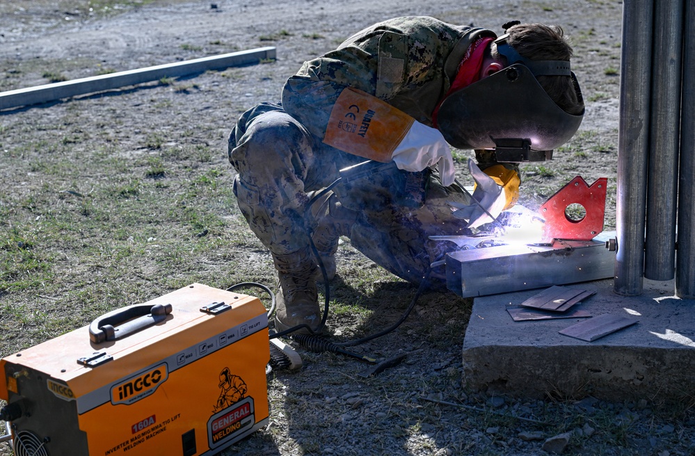 U.S. Navy Seabees upgrade infrastructure at the Escola Básica Filial Kasnafar engineering site during Pacific Partnership 2026 in Dili, Timor-Leste