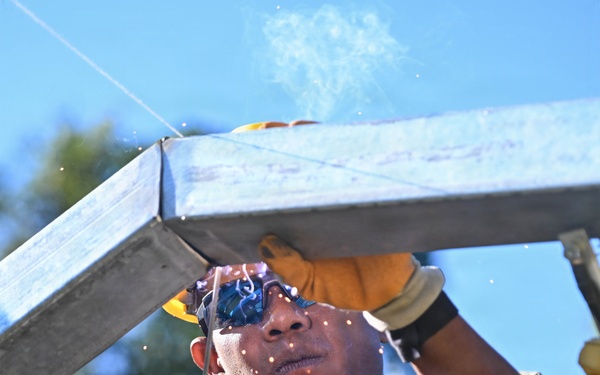 U.S. Navy Seabees upgrade infrastructure at the Escola Básica Filial Kasnafar engineering site during Pacific Partnership 2026 in Dili, Timor-Leste