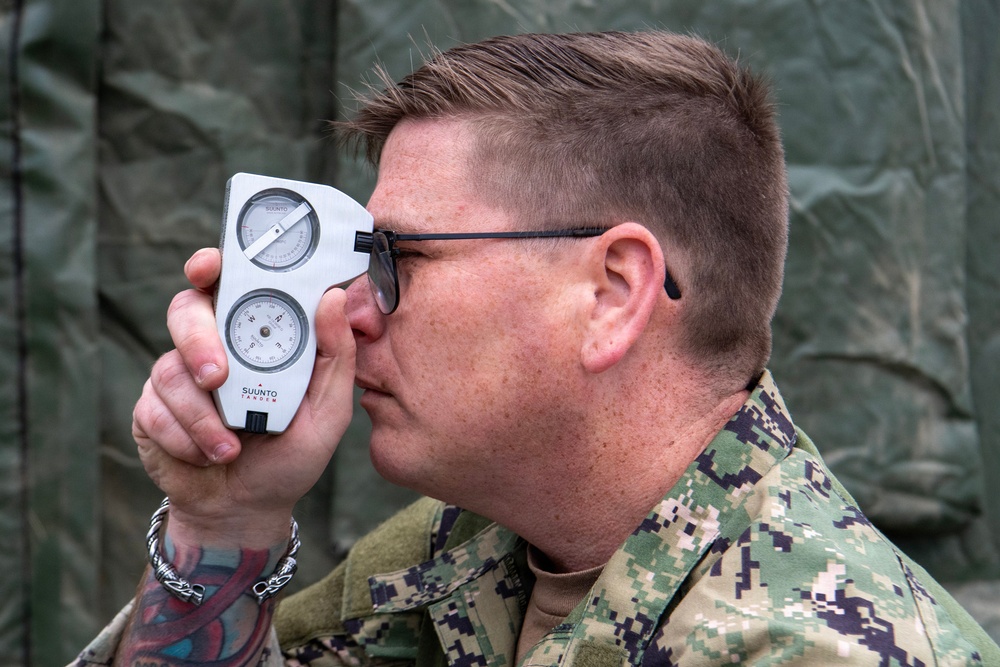 ET1 uses a range and bearing finder during Northern Viking 2026