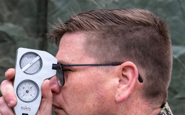 ET1 uses a range and bearing finder during Northern Viking 2026