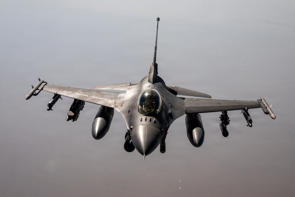 KC-135 refuels F16s for regional deterrence