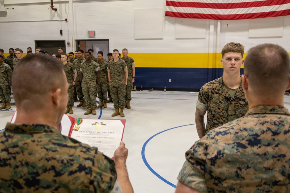 U.S. Marine receives Navy and Marine Corps Achievement Medal during awards ceremony