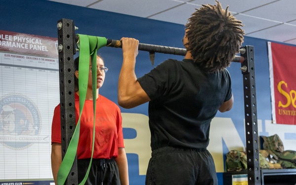 Marine Corps Applicant Conducts Pull-Ups at Recruiting Sub-Station During Physical Fitness Training