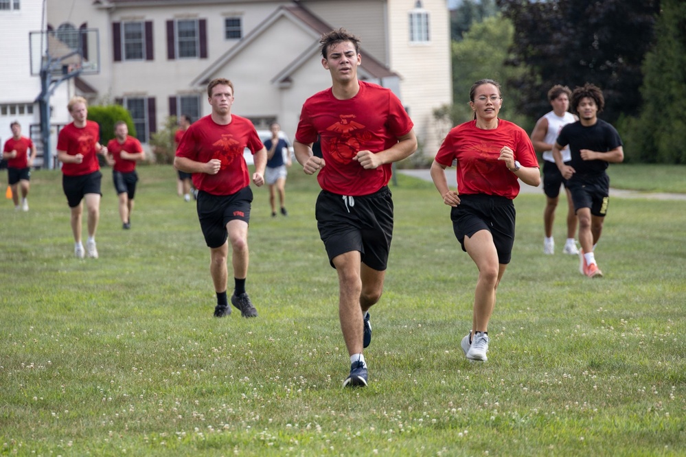 Marine Corps poolees conduct physical training run during fitness event