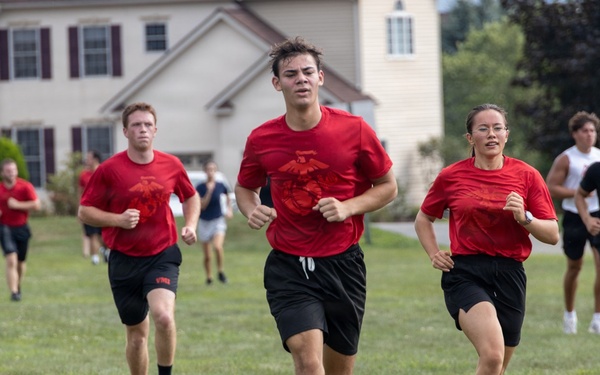 Marine Corps poolees conduct physical training run during fitness event