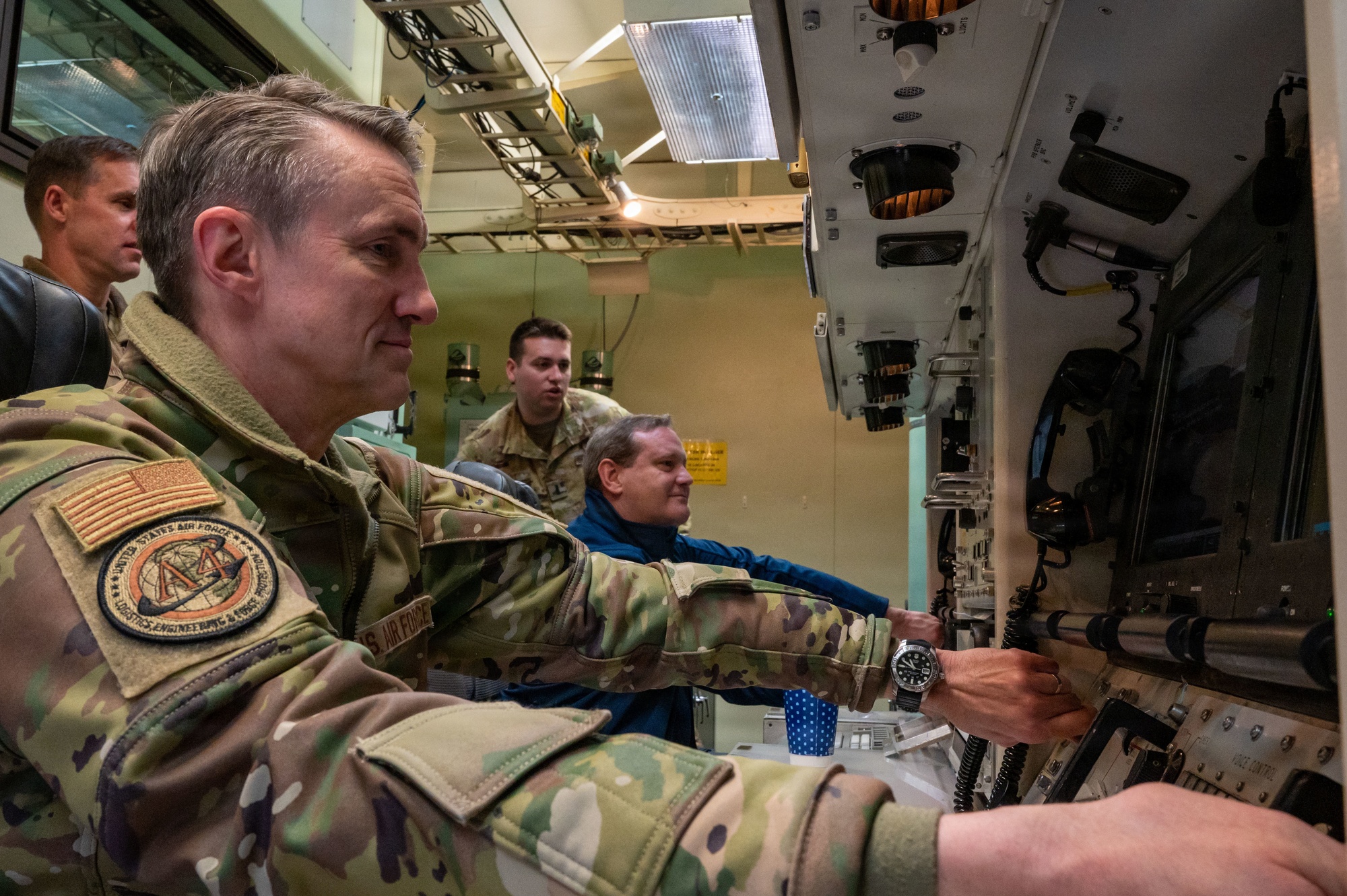 Lt. Gen. Miller and Honorable Andrew Hunter turn launch keys in a simulated launch control capsule.