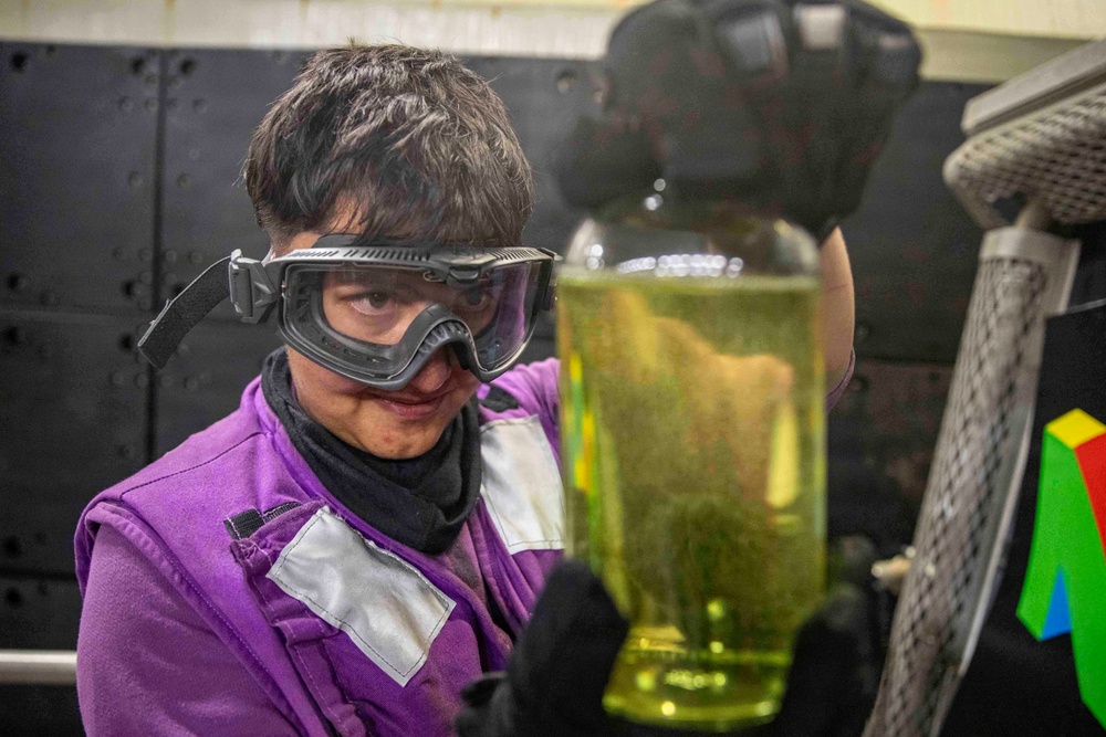 Aviation Boatswain's Mates conduct fuel testing onboard USS Makin Island