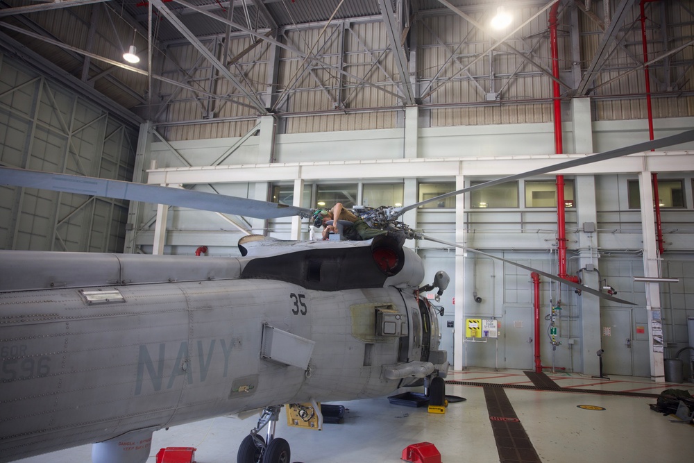 HSM-37 Sailors conduct helo maintenance