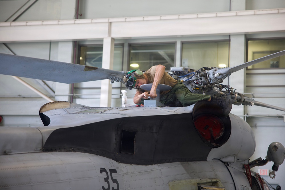HSM-37 Sailors conduct helo maintenance