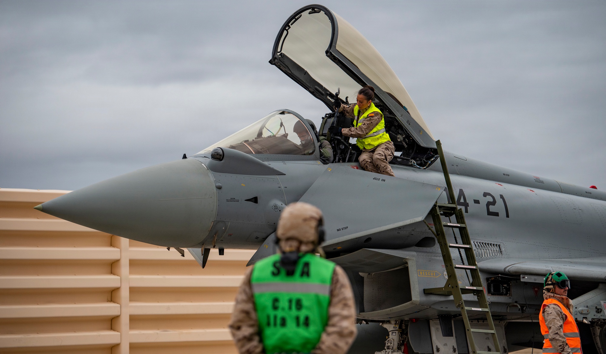 Airman assist pilot before takeoff.