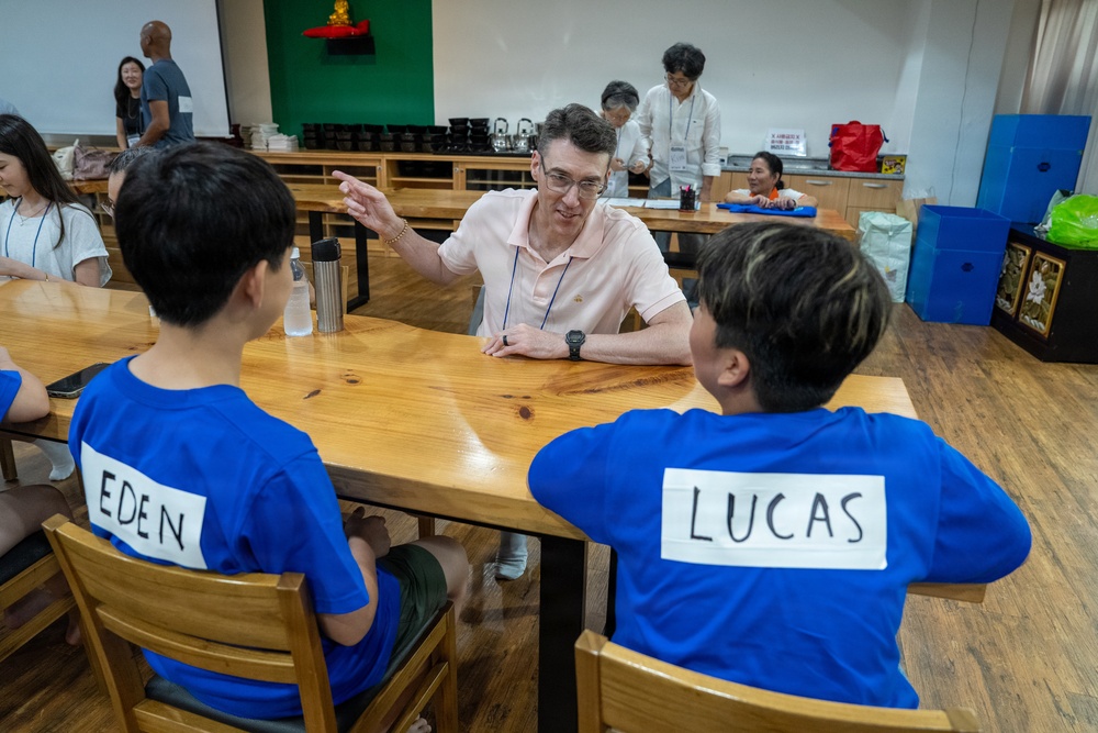 Commander, U.S. Naval Forces Korea Sailors teach English at Hongbeopsa Temple English Camp in South Korea