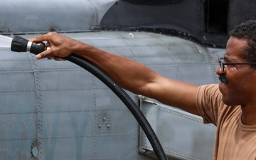 John Finn Washes a Helicopter