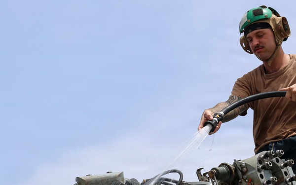 John Finn Washes a Helicopter