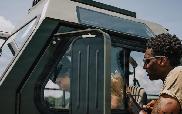 Putman guides K-loader trainee during certification