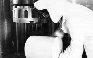 Historical Photo Radford Army Ammunition Plant employee on the production line cleaning after production
