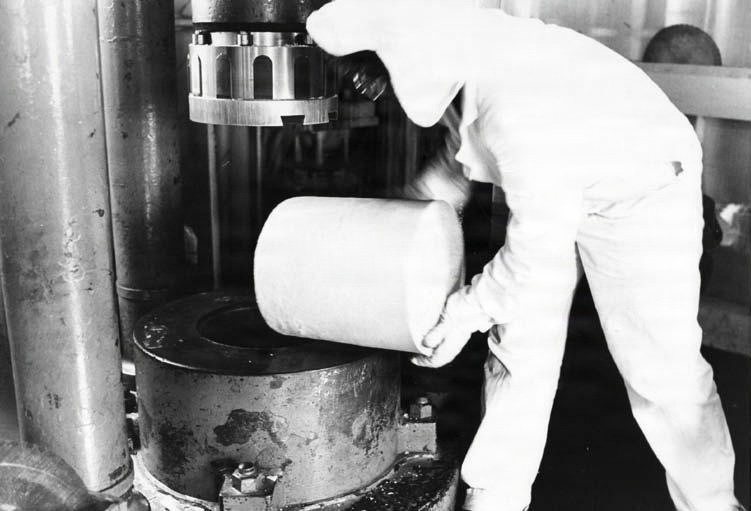 Historical Photo Radford Army Ammunition Plant employee on the production line cleaning after production