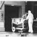 Historical Photo Radford Army Ammunition Plant employee moving a buggy as a part of the production process.