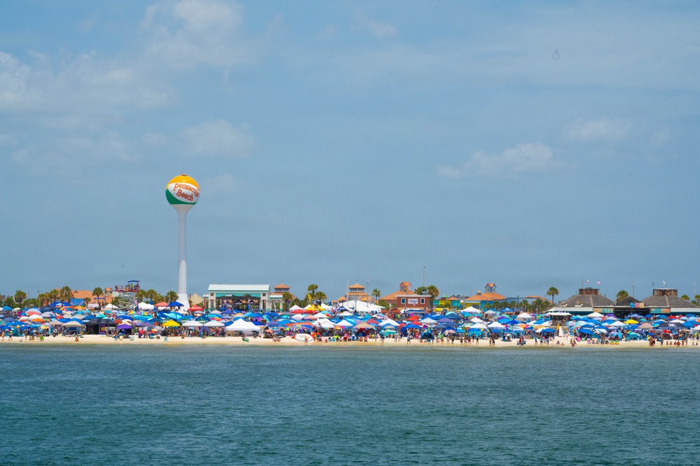 Beachgoers crowd Pensacola Beach, Florida to watch the U.S. Navy Blue Angels