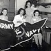Historic photo of employees with Army/Navy flag at Radford Ordnance Works.